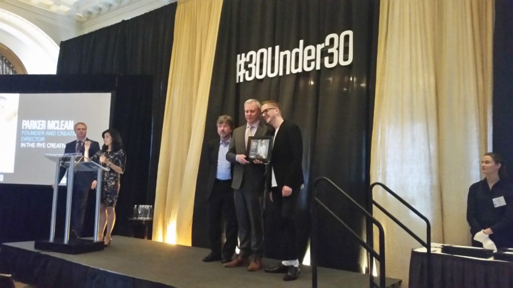 Bruce Green, Partner at Oyen Wiggs, presents an award to Parker Mclean at the BCBusiness 30 under 30